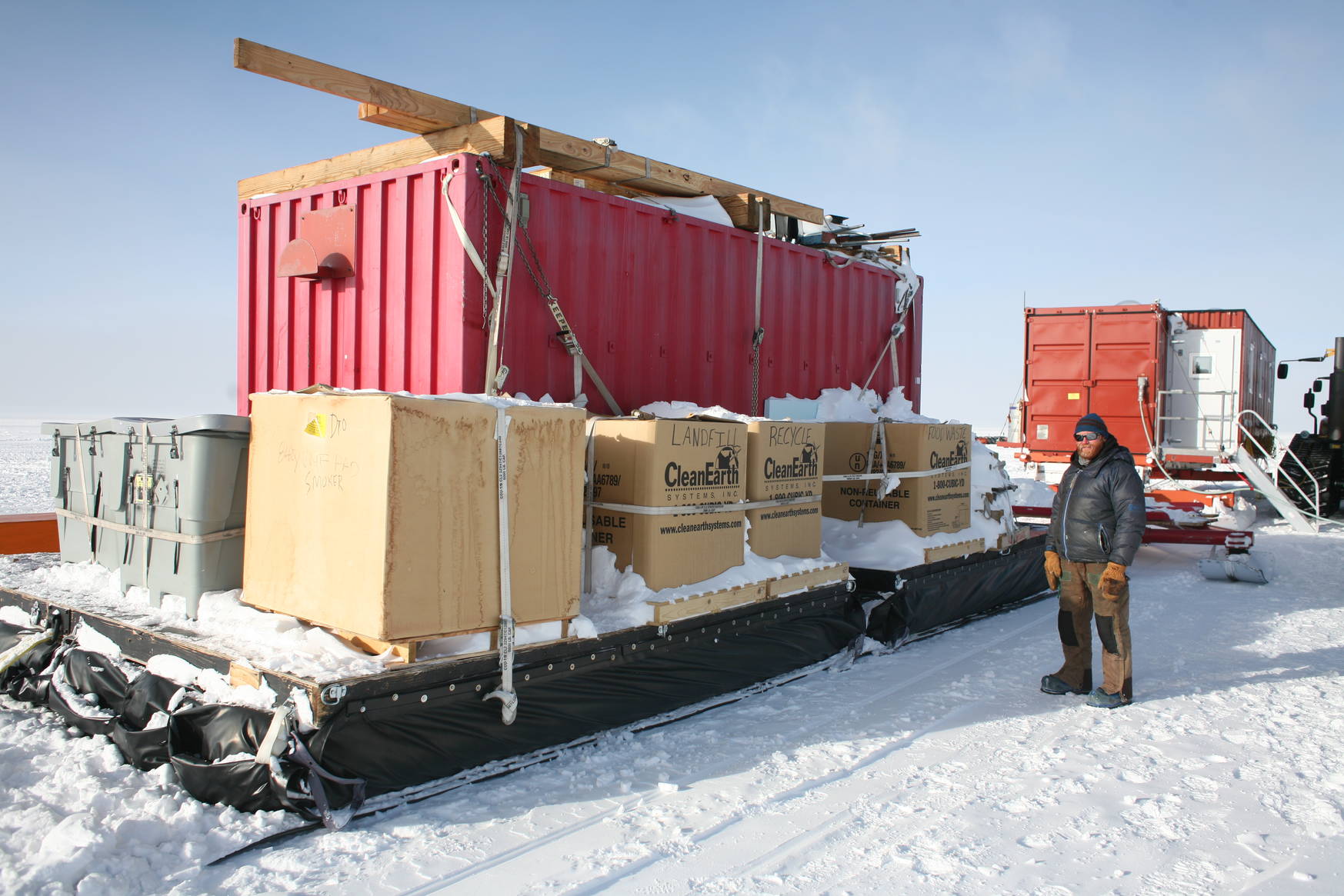 Two of the four containers: The closer one
is for storage of food, tools, trash, etc. The one further away contains five
bedrooms, each shared by two persons.