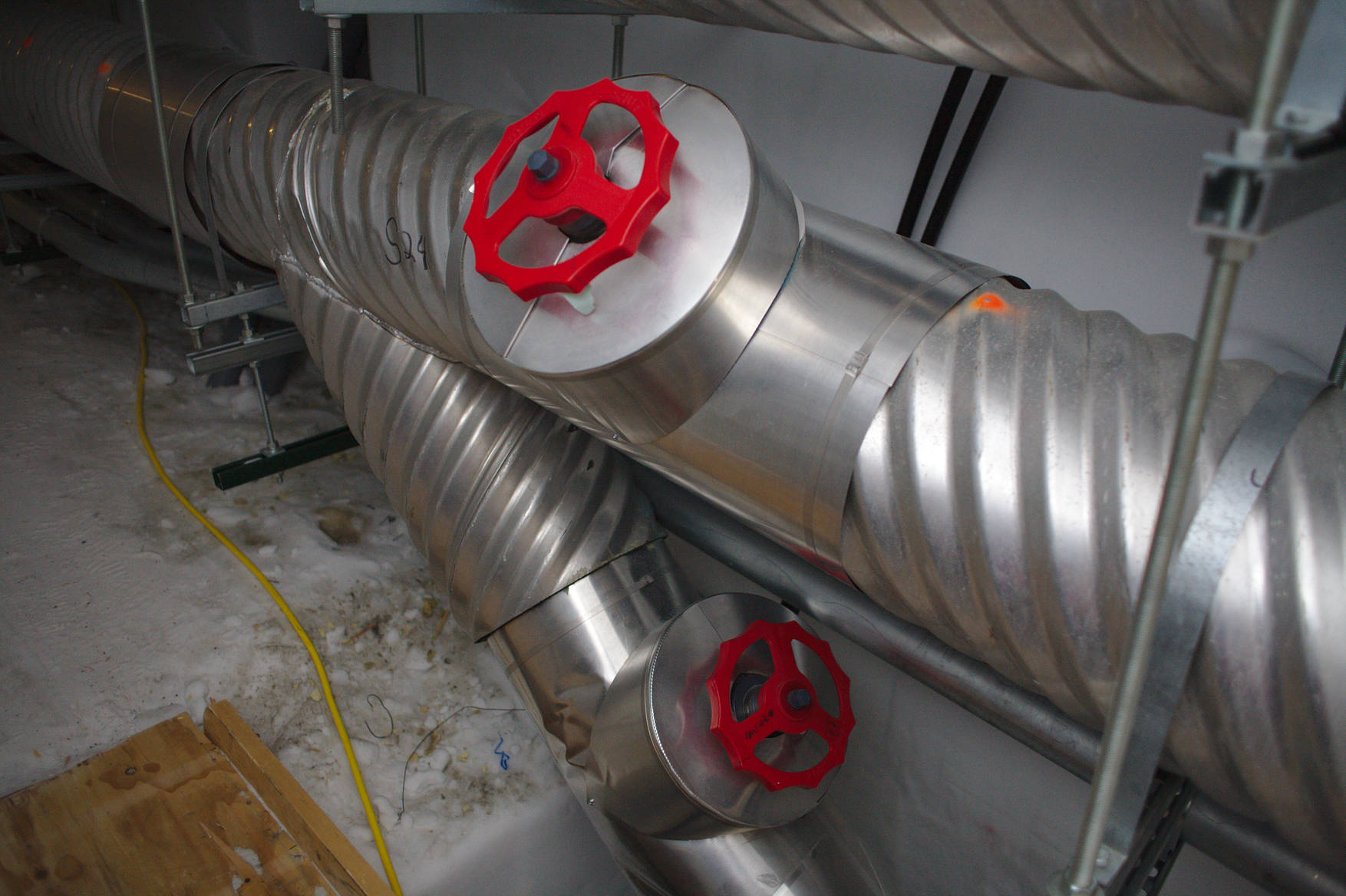 Pipes for sewage and fresh water run along the walls of the tunnels