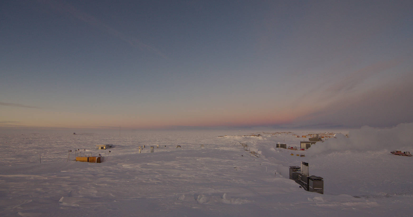 In the opposite direction the Earth casts a shadow onto its own atmosphere, painting the sky in purple and dark blue.